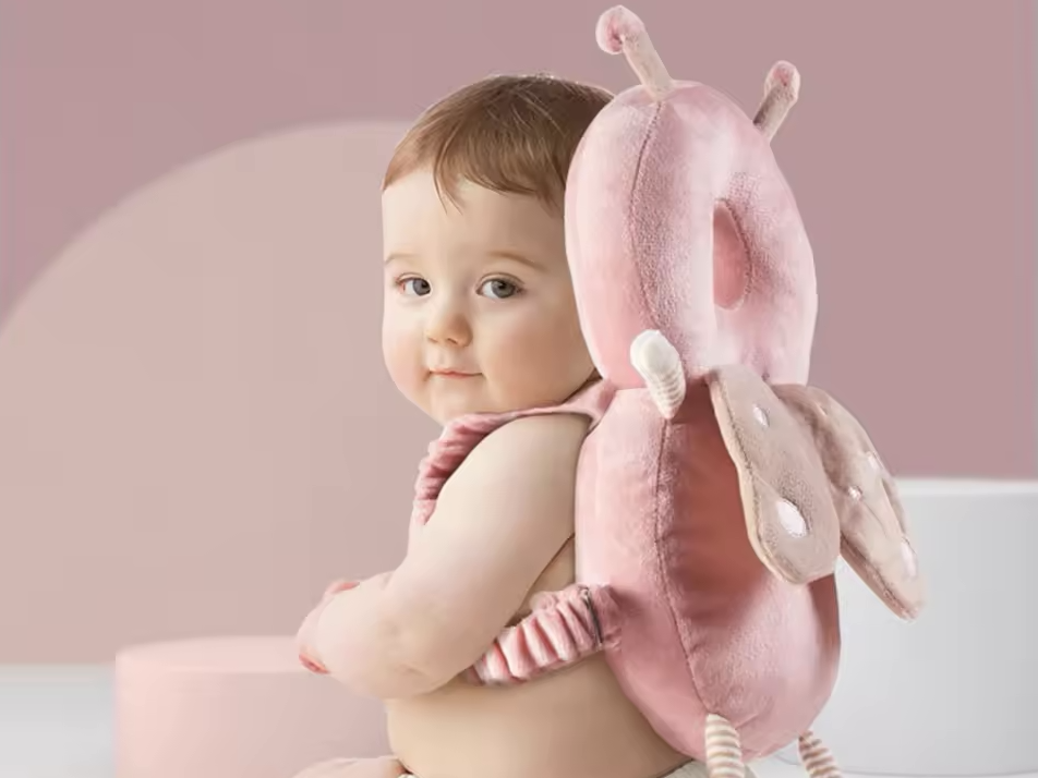 Baby Head Protection Backpack showcased on a smiling baby, emphasizing safety and comfort